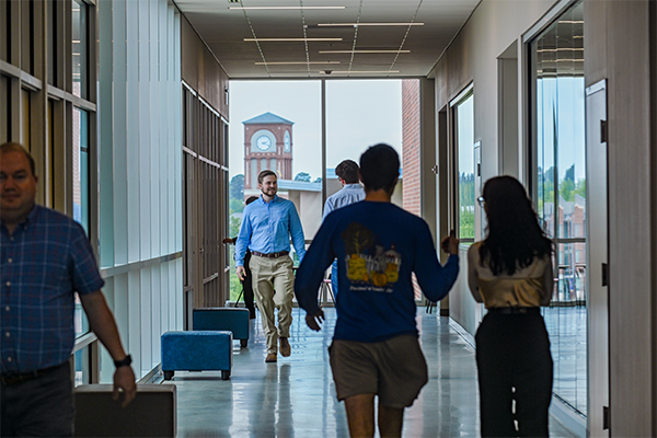 Individuals Walking in Building