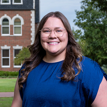 Lexi McBride standing outside Hale Hall