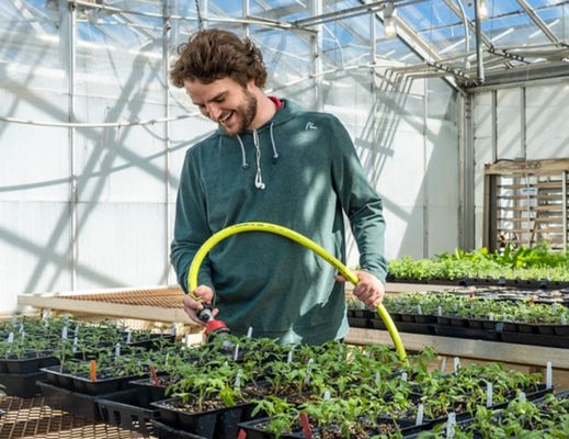 Student watering plants