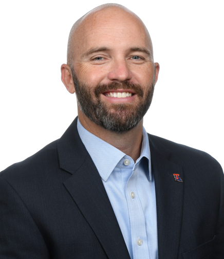 Headshot of Adam McGuirt on a white background