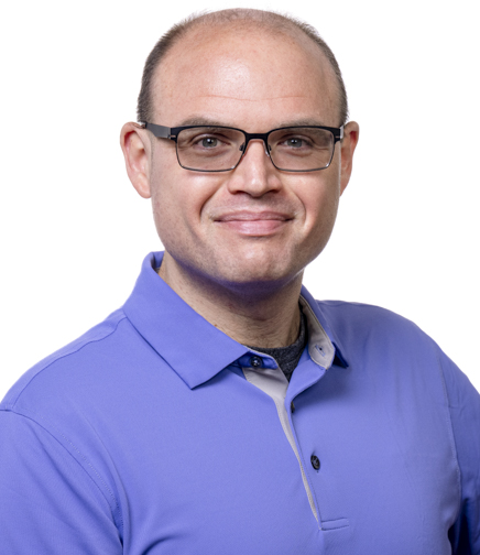 Headshot of Micheal Wells on a white background