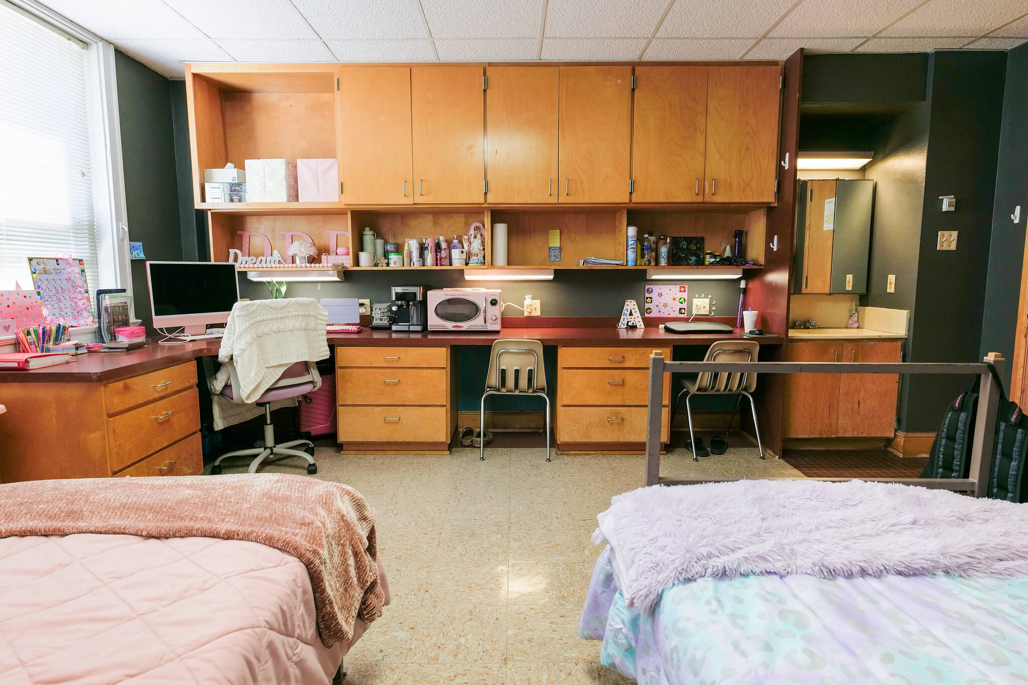 A desk and chairs in Aswell Hall dorm