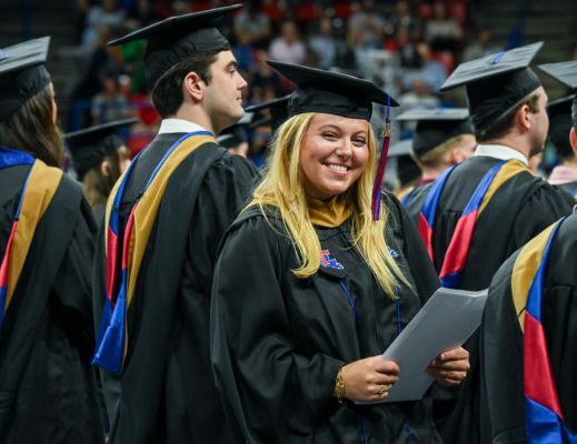 Female MBA graduate celebrating at graduation