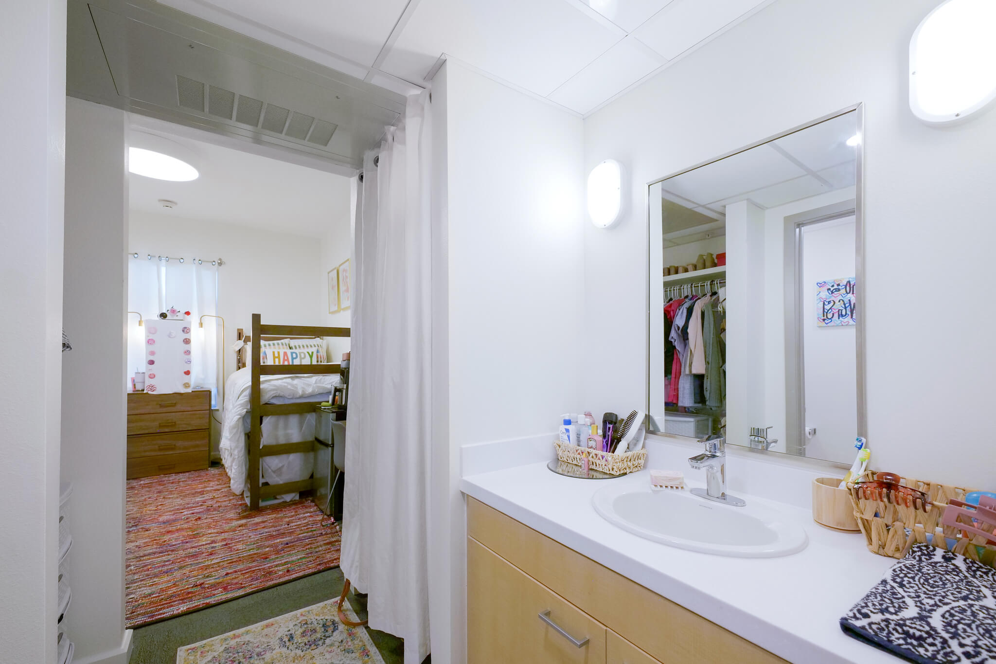 Part of a bathroom and a doorway into a bedroom in Mitchell Hall