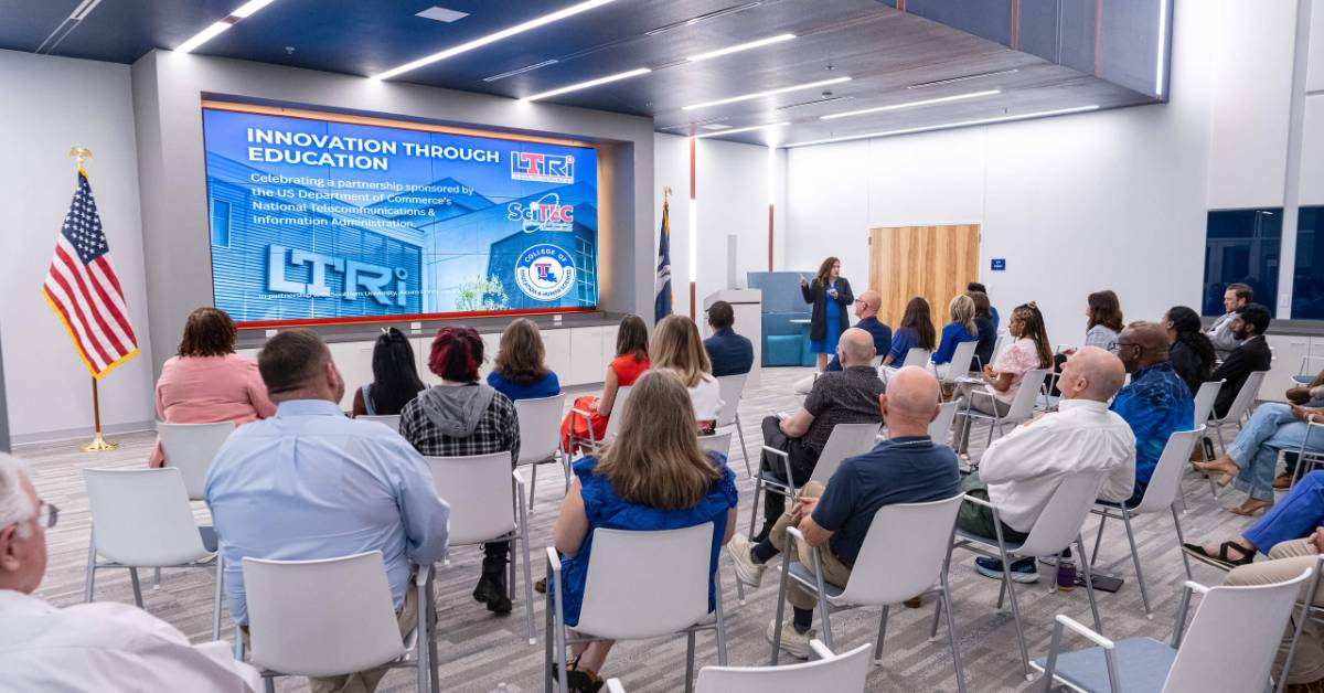 A group watches a presentation at the LTRI building