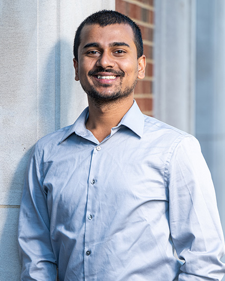 Rakesh poses on the steps of Howard Auditorium.