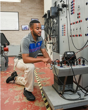 A student works in the electrical engineering lab.