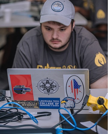 A computer science student participates in the annual hack-a-thon, Cyber Storm