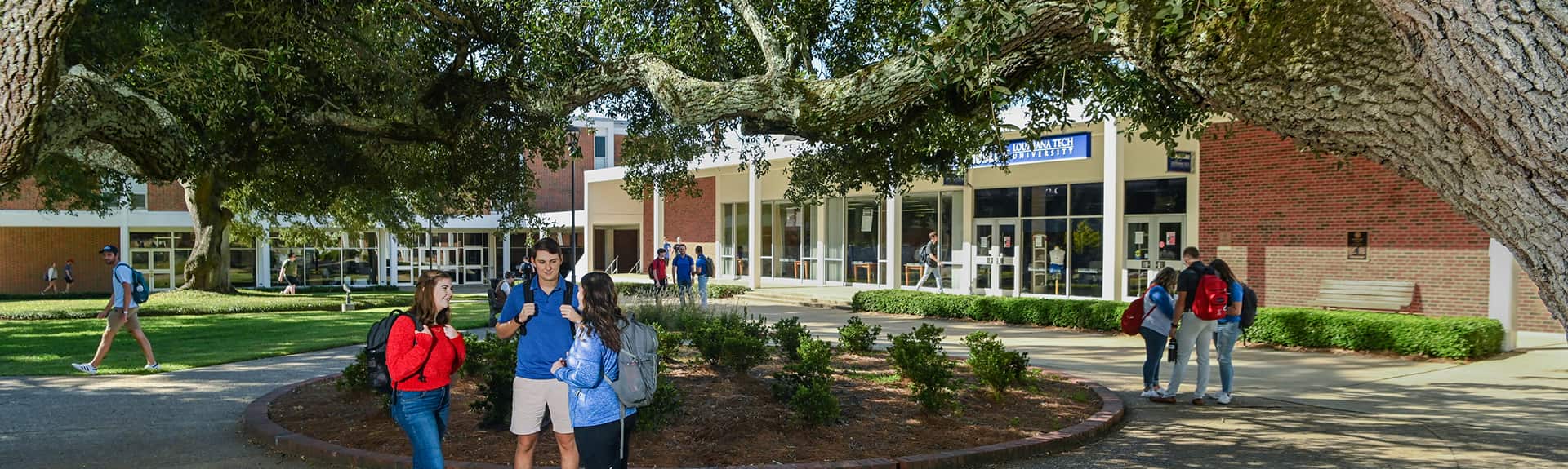Students huddled talking on campus