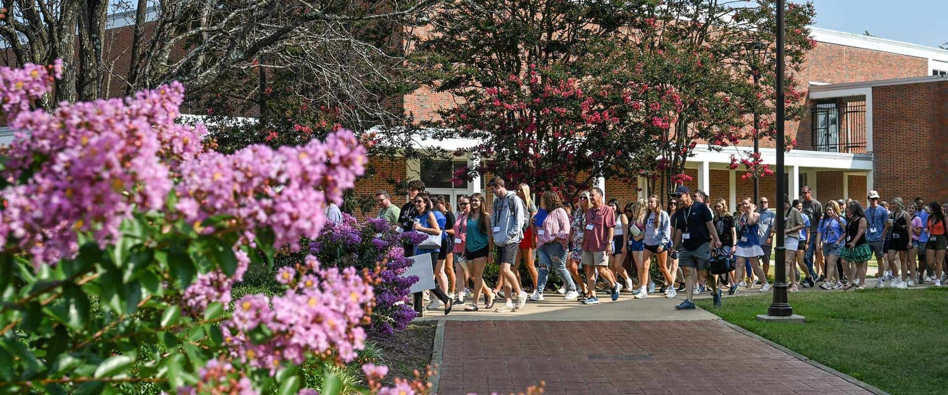 Tour group walking on campus