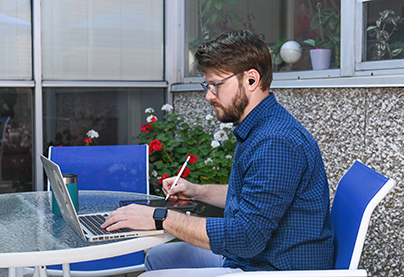 A student works on a laptop in the College of Educationa nd Human Sciences