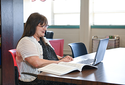A student studies on her laptop.