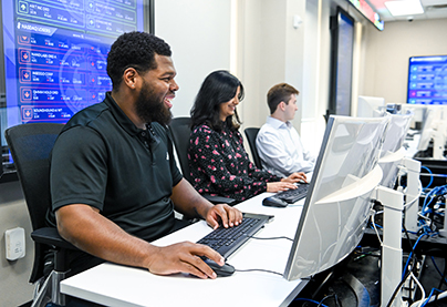 Students work in Ray's Trading Room in the College of Business