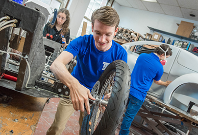 Engineering student work on teh Shell EcoMarathon car.