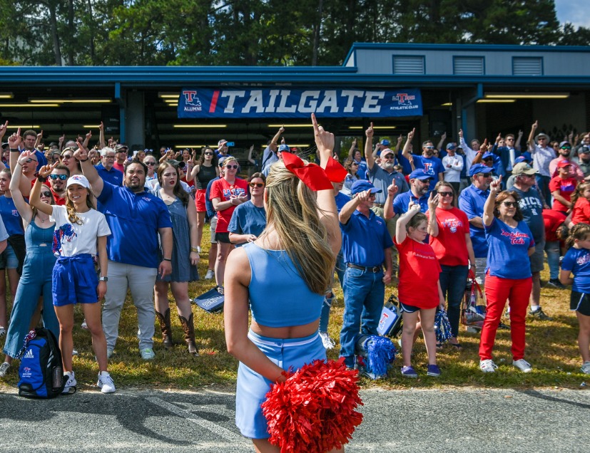 Tech cheerleader in front of Argent Pavilion