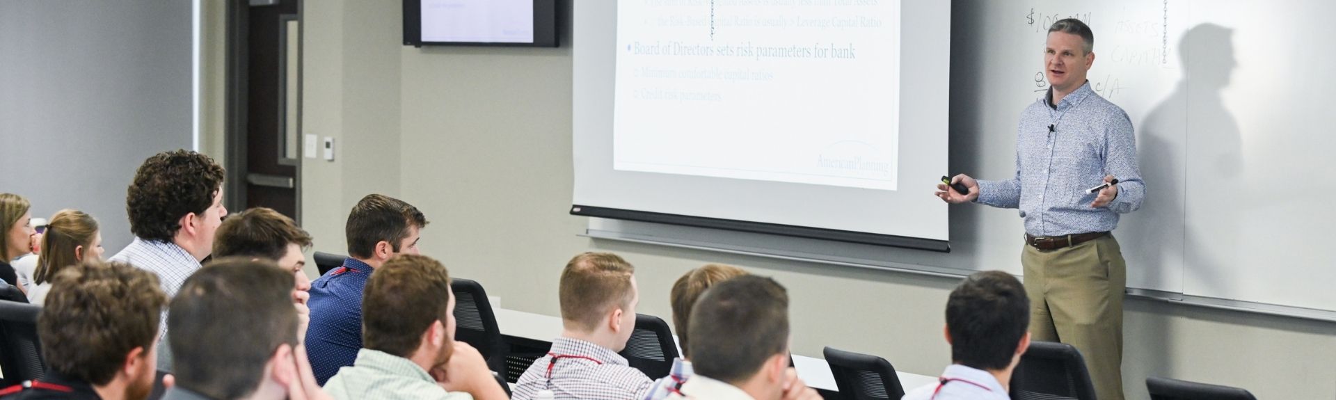 Students in a School of Banking class listening to an industry partner lecture