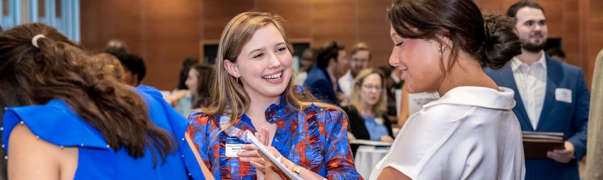 Female student and female employer partner speaking at Employer Reception