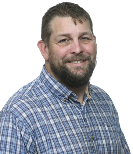 Headshot of Joshua Adams on a white background