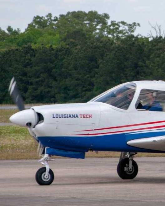 Louisiana Tech plane landing on runway