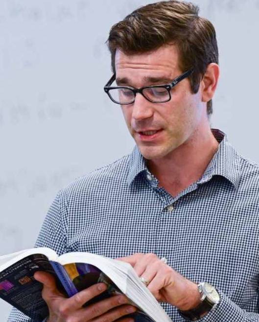 professor reading book