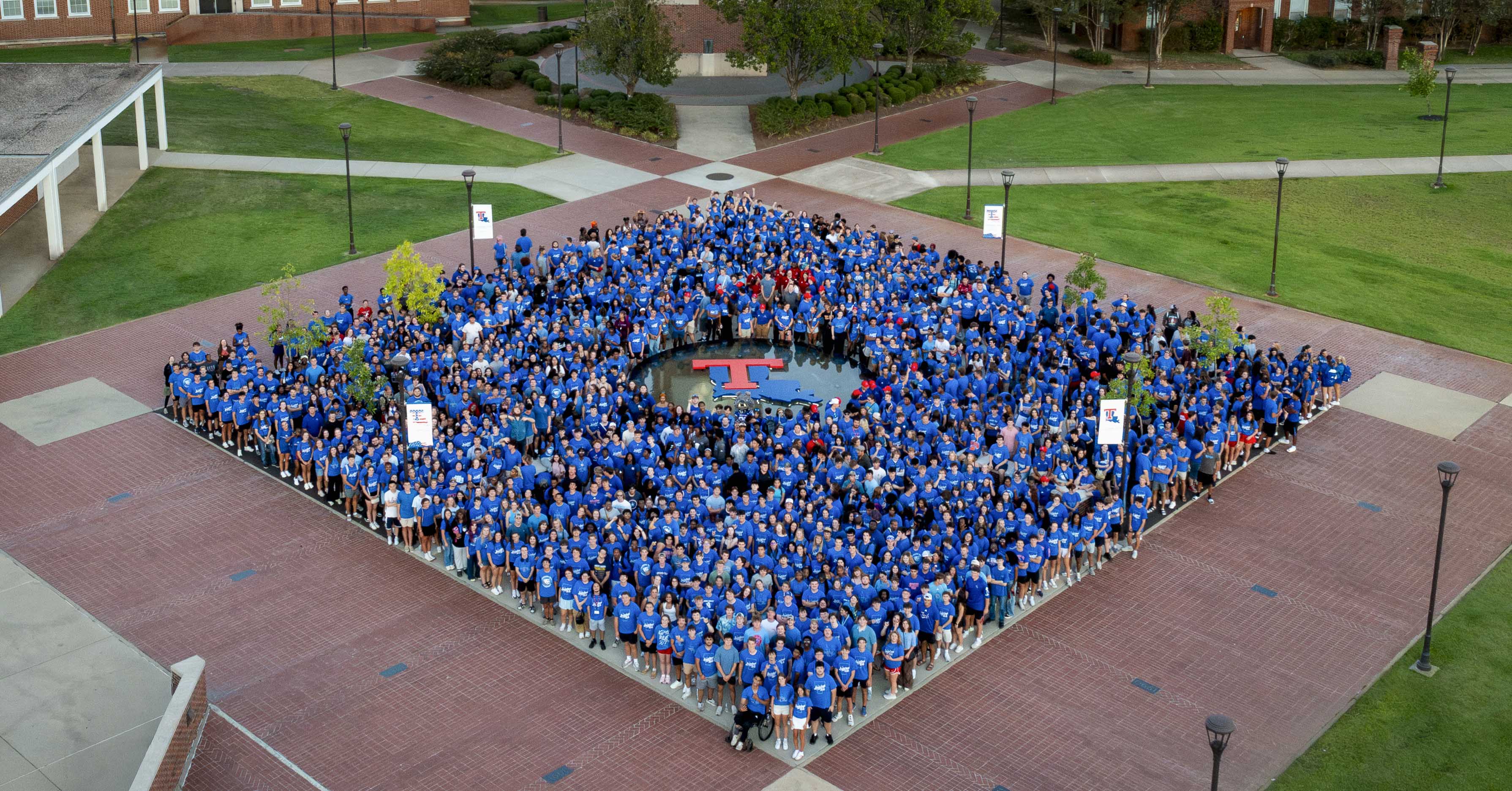 The Louisiana Tech Class of 2030 gather together in a large diamond formation in Centennial Plaza on campus.