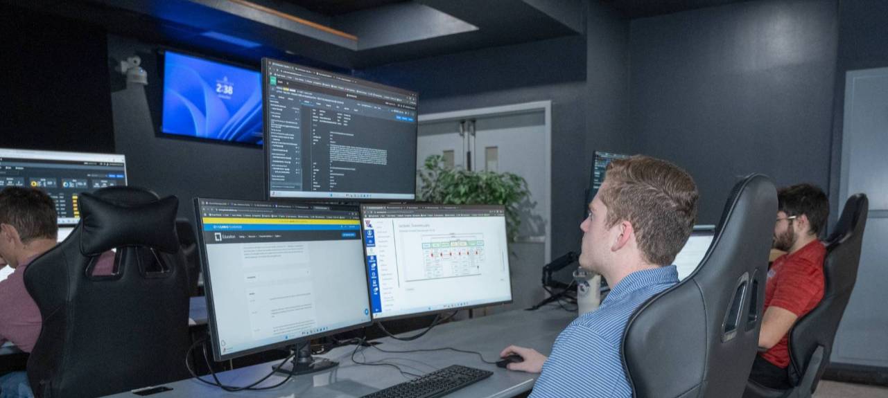 student working on the student center looking at the screen analyzing data.