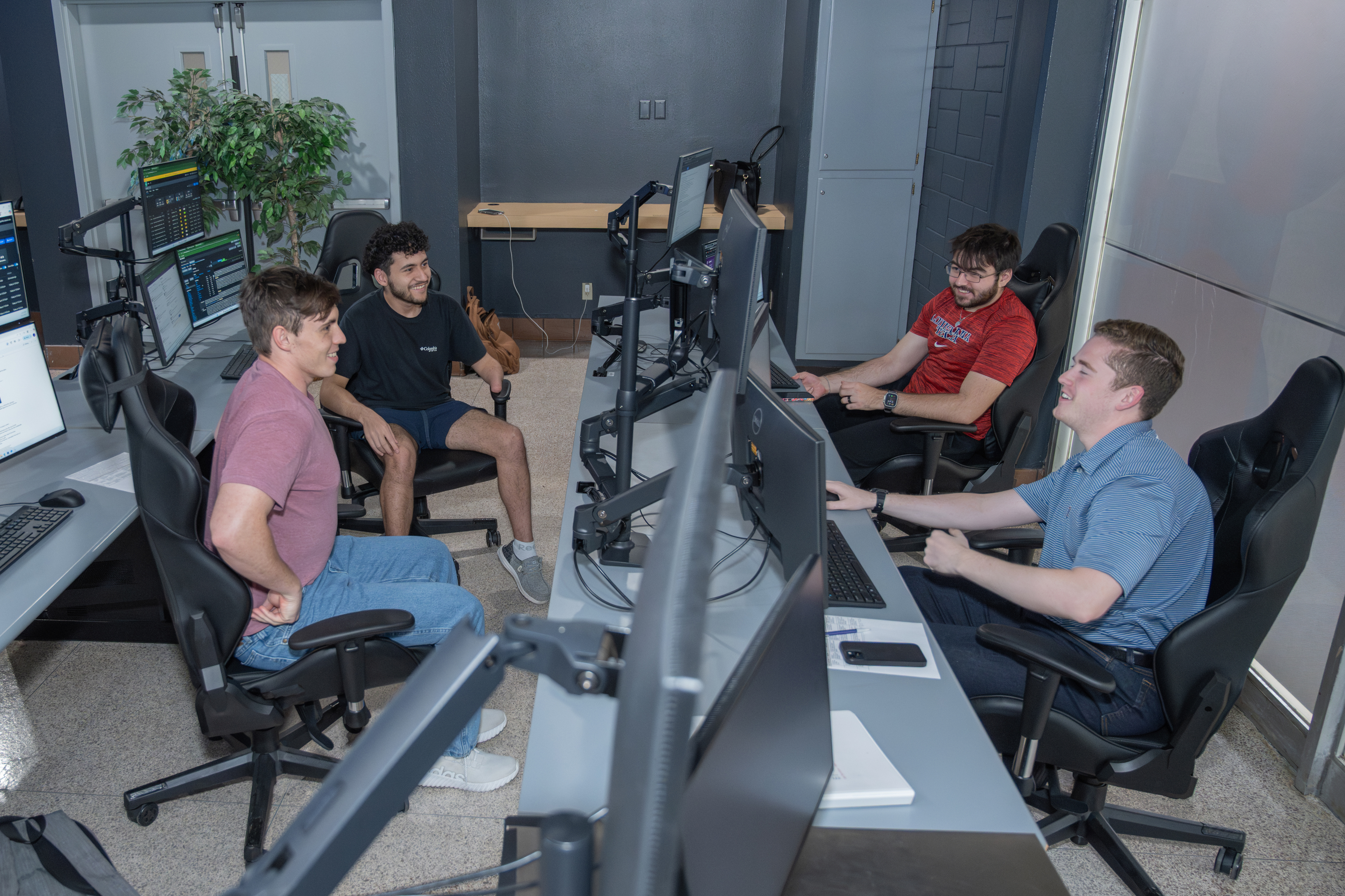 Students on Security operations center discussing with each other